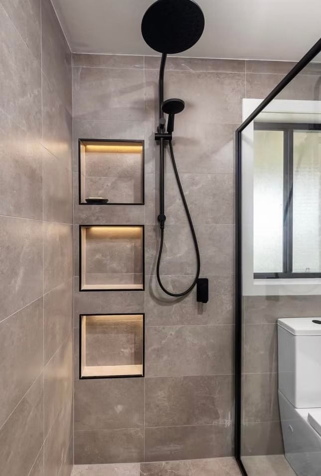 A bathroom with a walk in shower and a toilet.