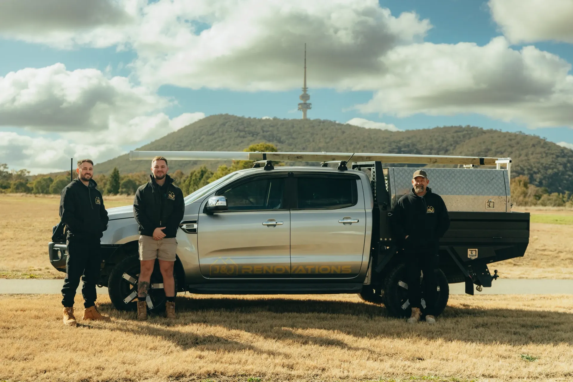 J&J Renovations team posing in front of camera 