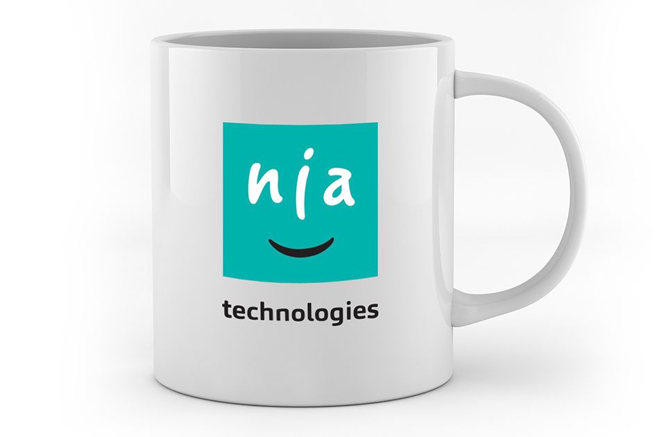 Nia Technologies logo on a white mug
