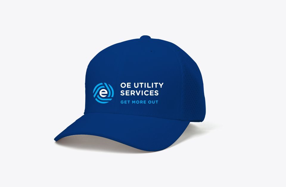 OE Utility Services logo on baseball cap