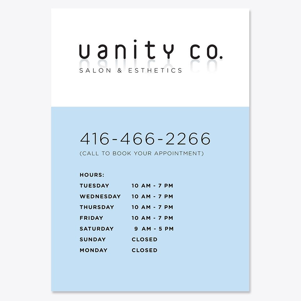 Sign with opening and closing times for Vanity Co. 