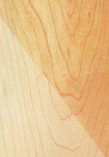 A close up of a piece of wood showing the texture of the wood.