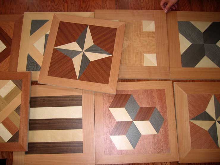 A bunch of wooden squares with different designs on them