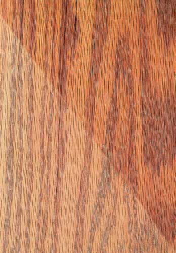 A close up of a piece of wood showing the grain and texture.
