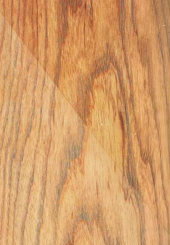 A close up of a piece of wood showing the grain and texture.