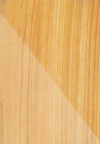 A close up of a piece of wood next to a piece of clear wood.