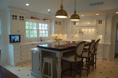 kitchen with white cabinets and farmhouse island