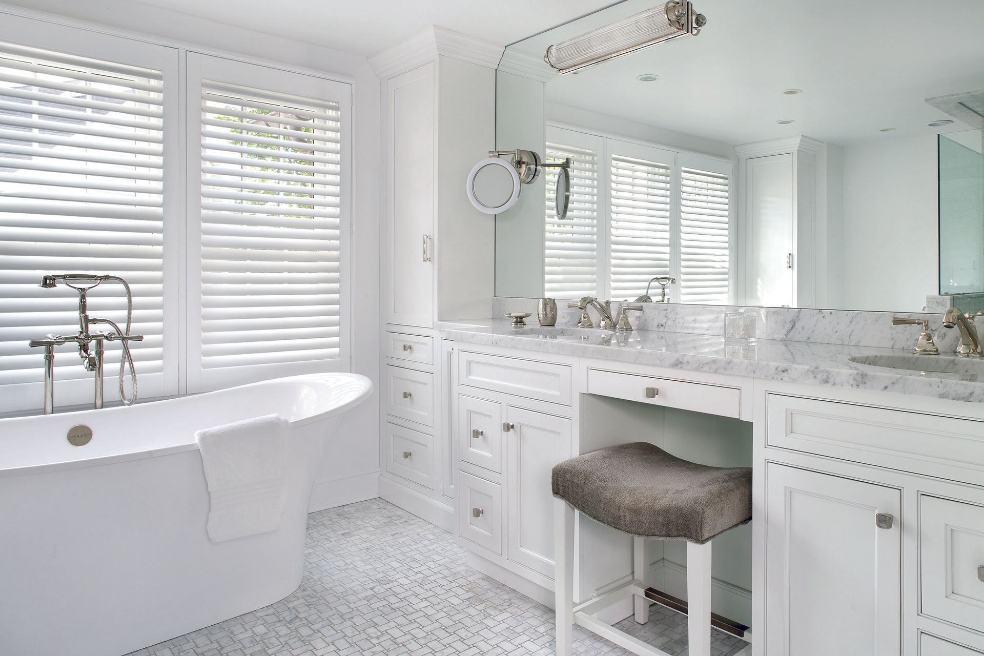 master bathroom with tub and makeup space 1