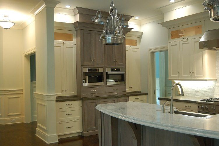 Luxury kitchen with gray and white cabinets