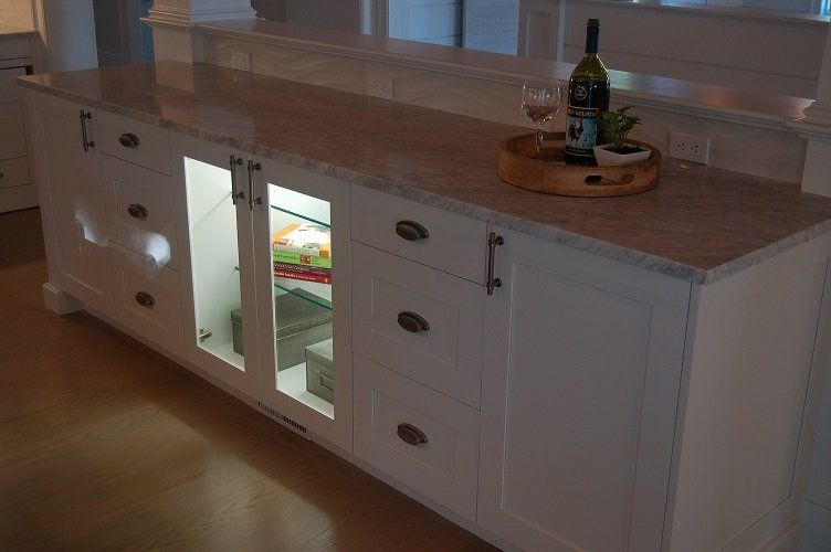 white kitchen cabinets with lighting