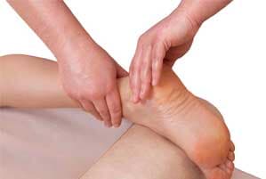 Massage of the patient's foot - orthopedic surgeon in Peoria in Pekin IL