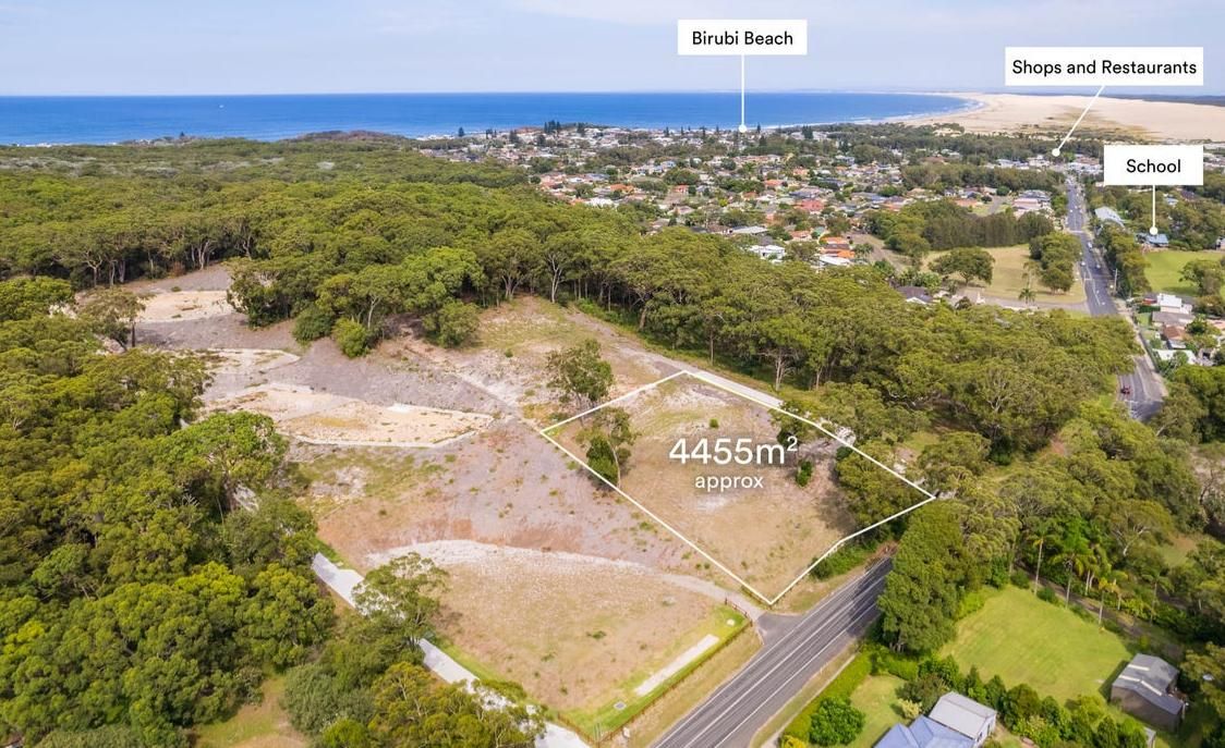 An Aerial View of A Residential Area with Trees and A Road — Duggan Mather Surveyors in Taylors Beach, NSW