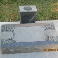 headstone with vase