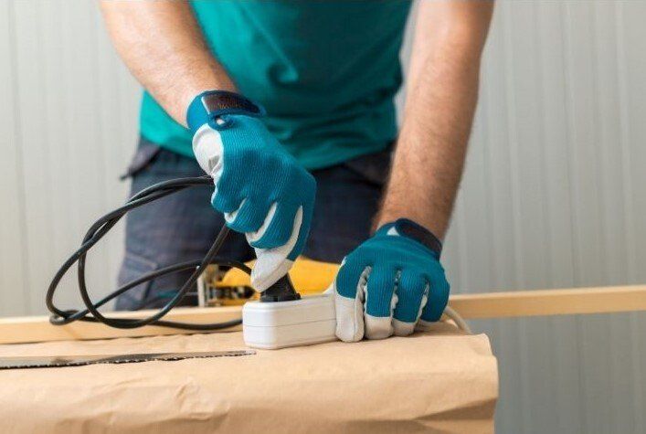 handyman fixing electrical equipment