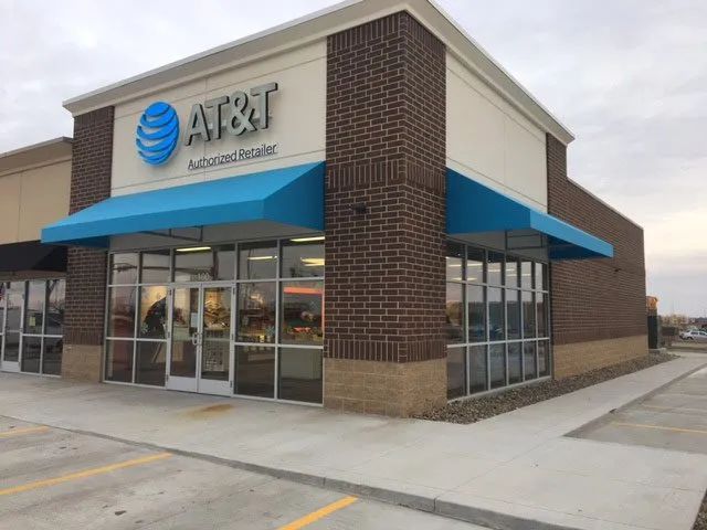 An at & t store with a blue awning.