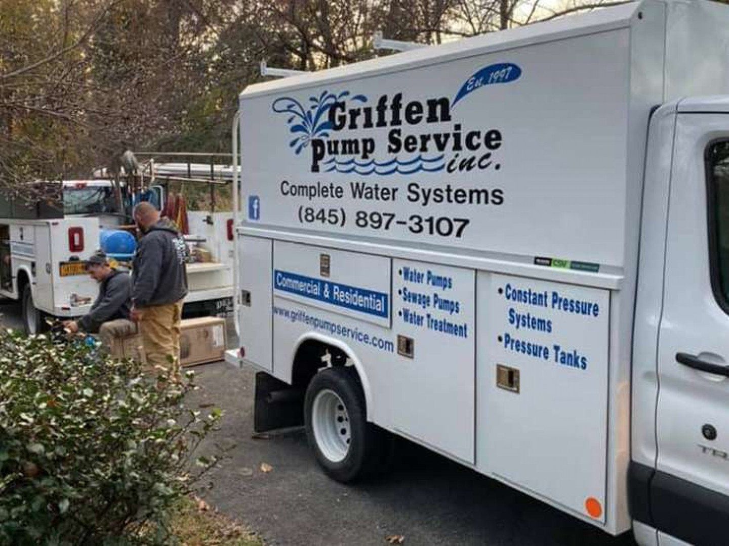 A griffen pump service truck is parked in a parking lot