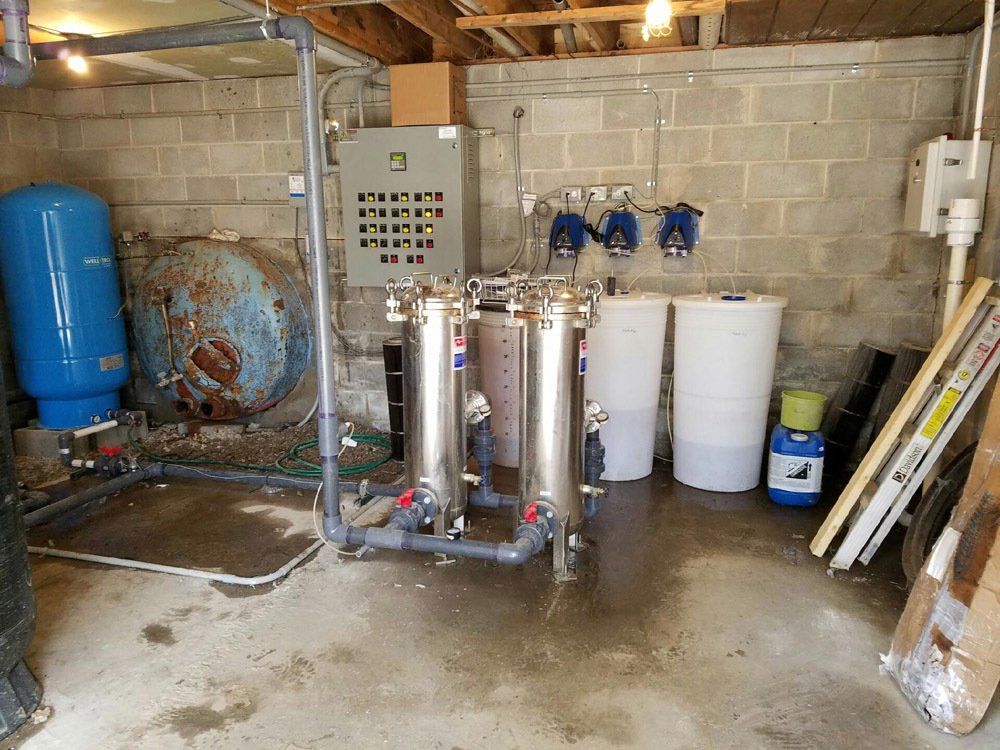 A room with a lot of pipes and tanks in it