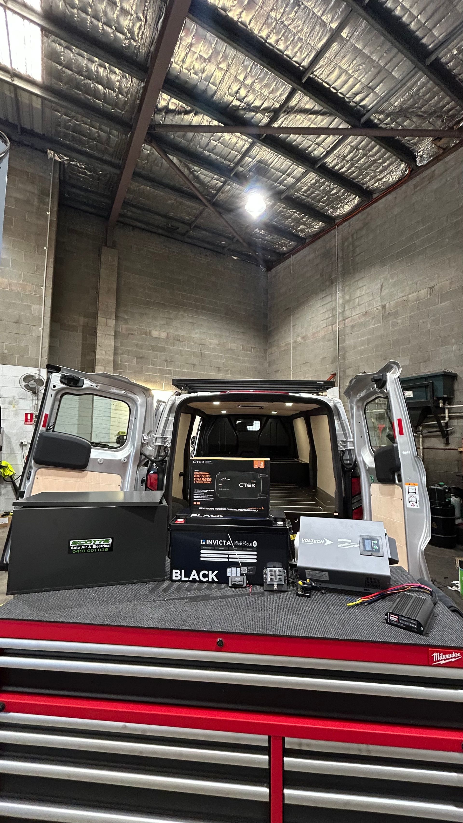 A van is being fitted out in a mechanic workshop with electrical — Scotts Auto Air & Electrical In Wollongong, NSW