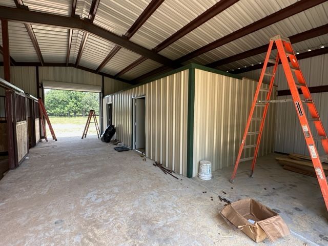 A ladder is sitting in the middle of a building