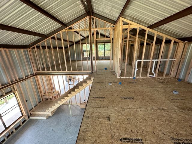 The inside of a building under construction with a staircase