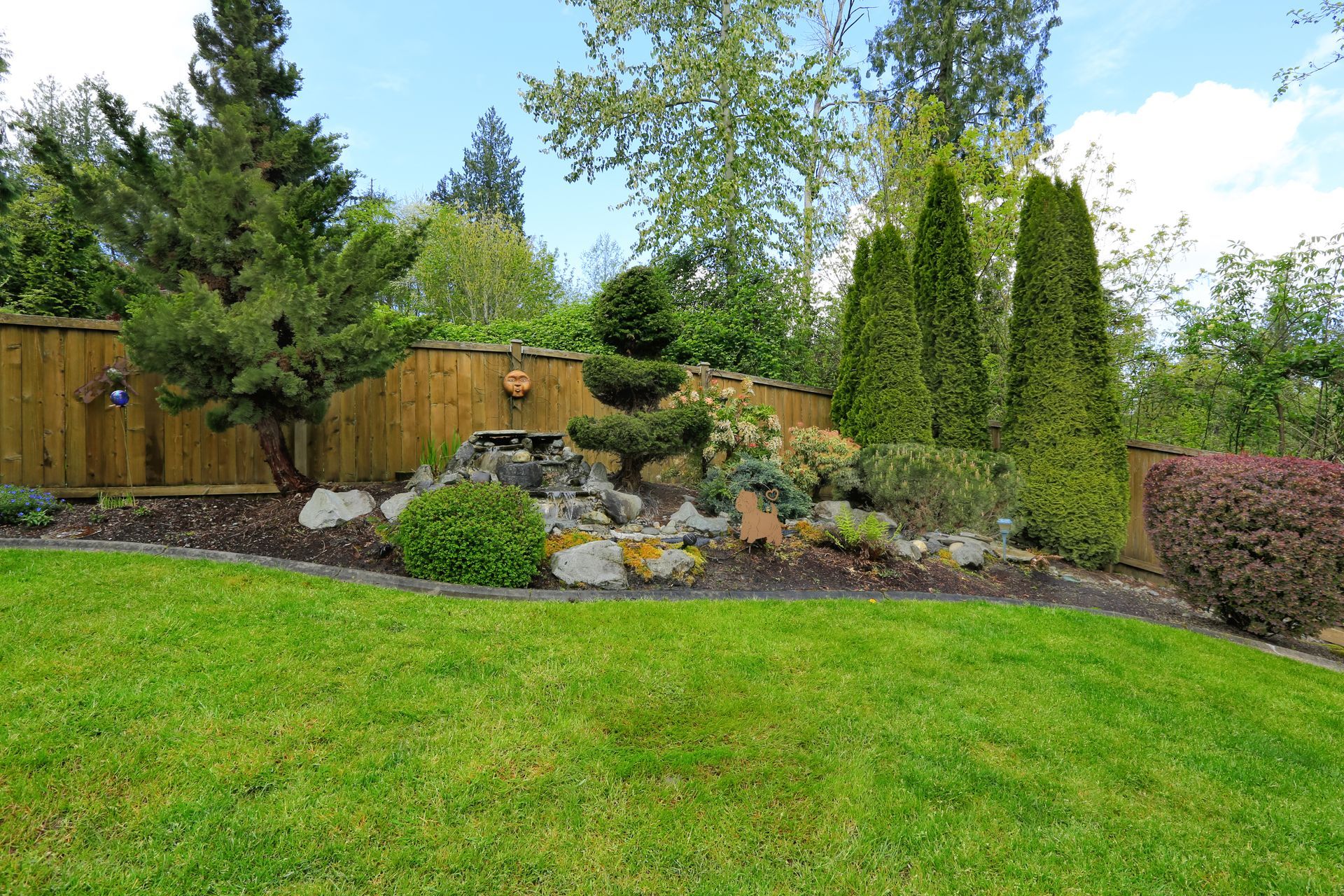 There is a waterfall in the middle of the garden.