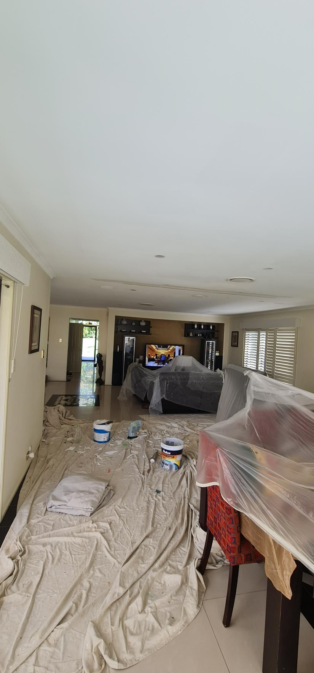 A Living Room Is Being Painted In A House — Blue Painting & Decorating In Taylor, ACT