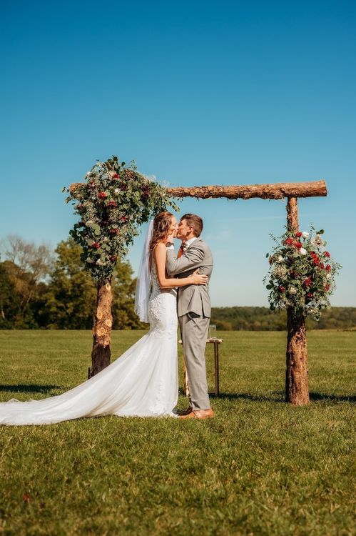 bride and groom at alter for first kiss with beautiful views