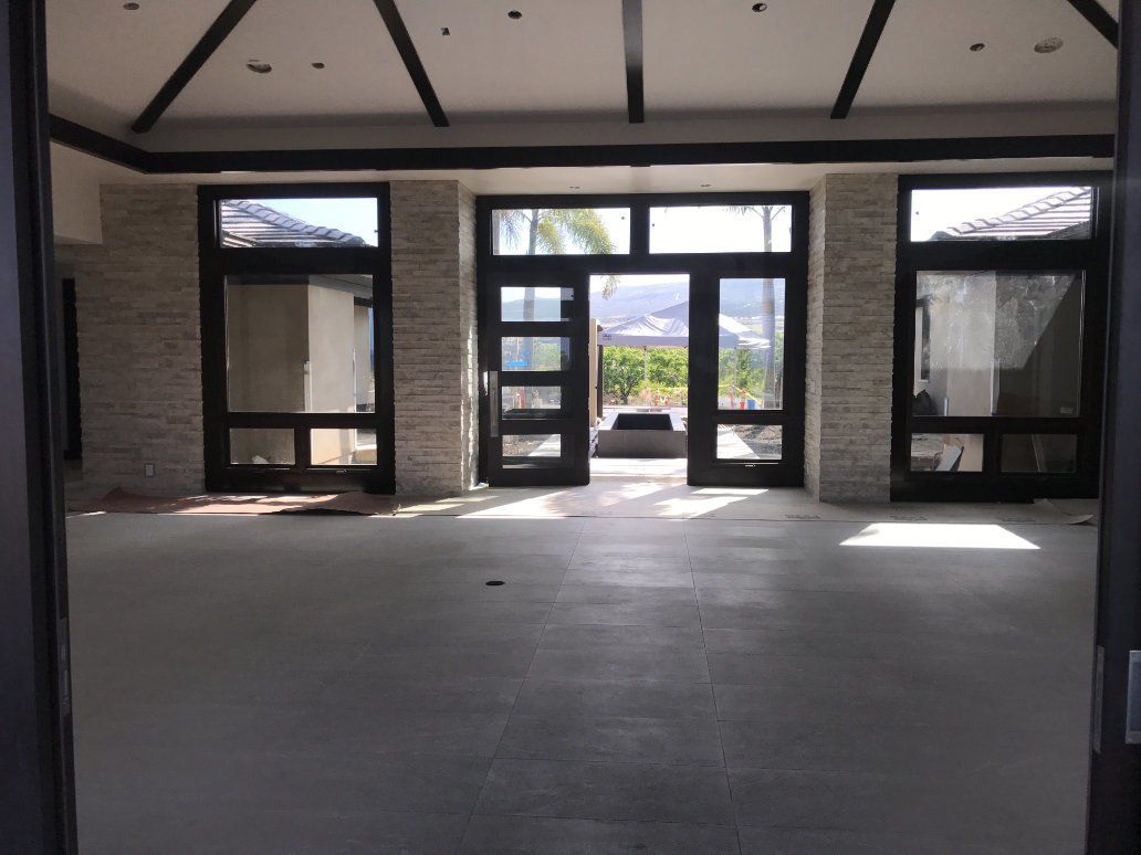 house under construction showing tiled pillars. 