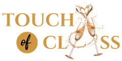 A logo for touch of class with two glasses of champagne