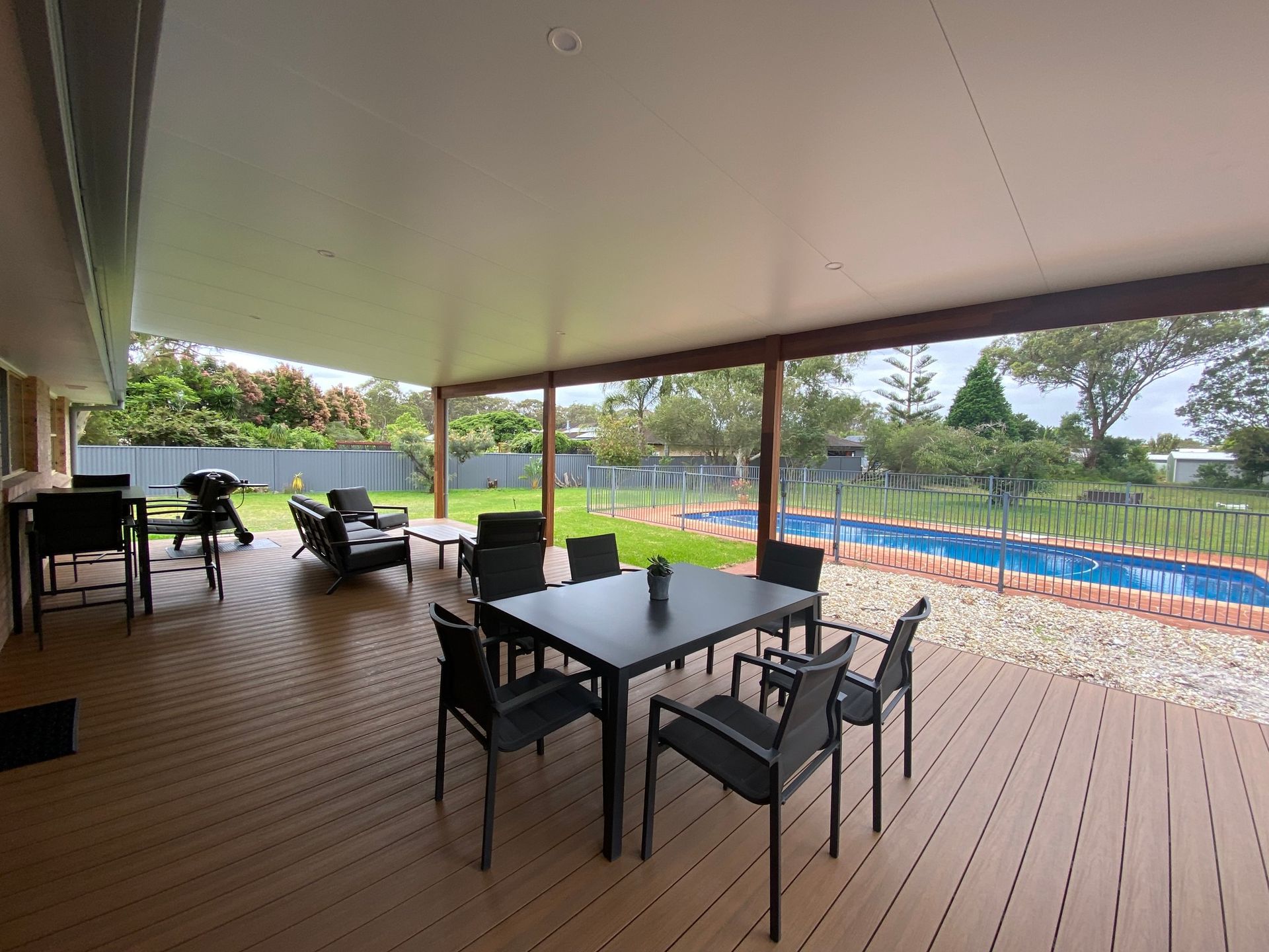 Patio With Dining Table, Chairs, Lounge Chairs, and a Grill — BK Building Services Pty Ltd In Taree, NSW