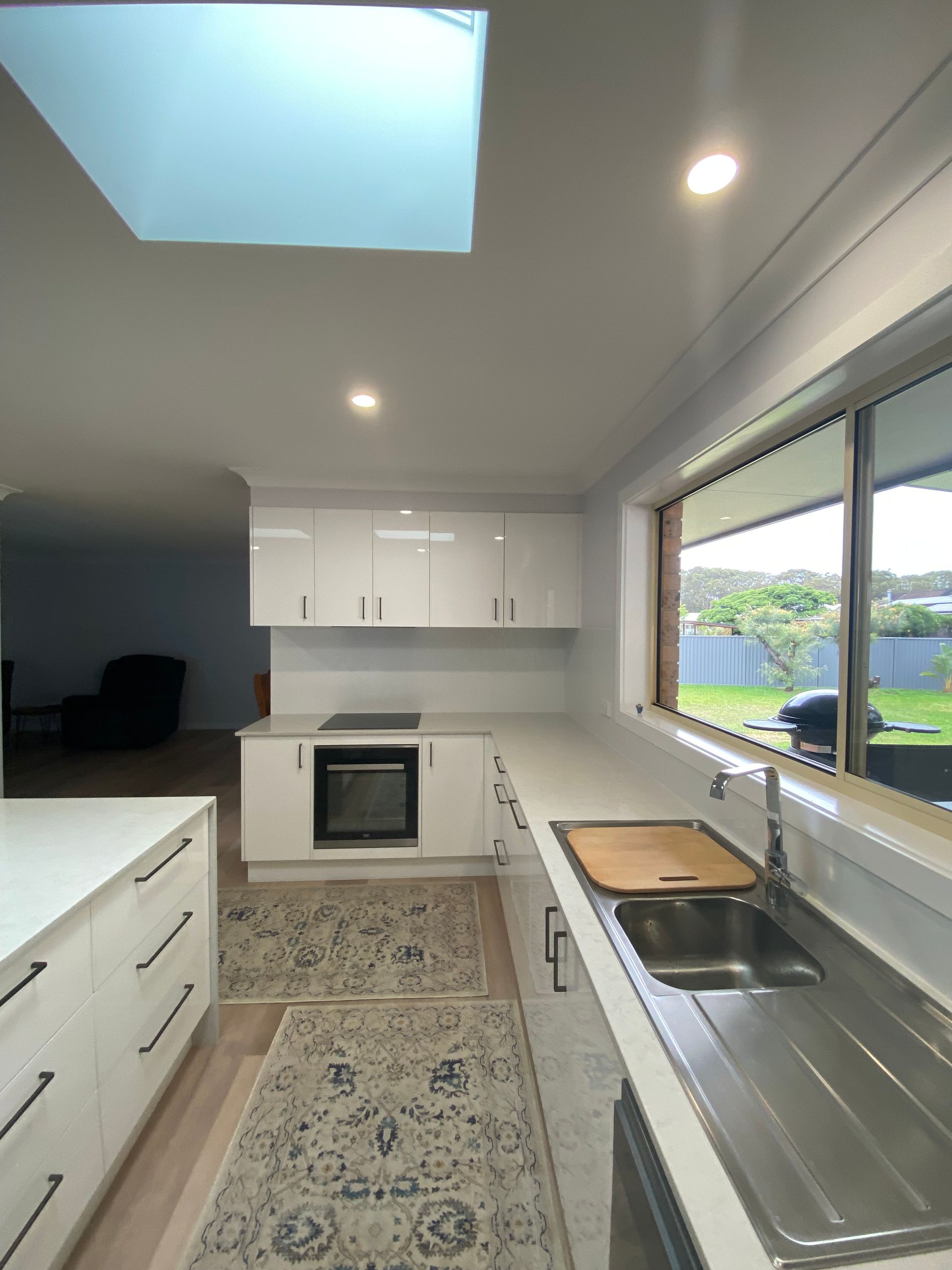 Bright, Modern Kitchen With White Cabinetry — BK Building Services Pty Ltd In Taree, NSW