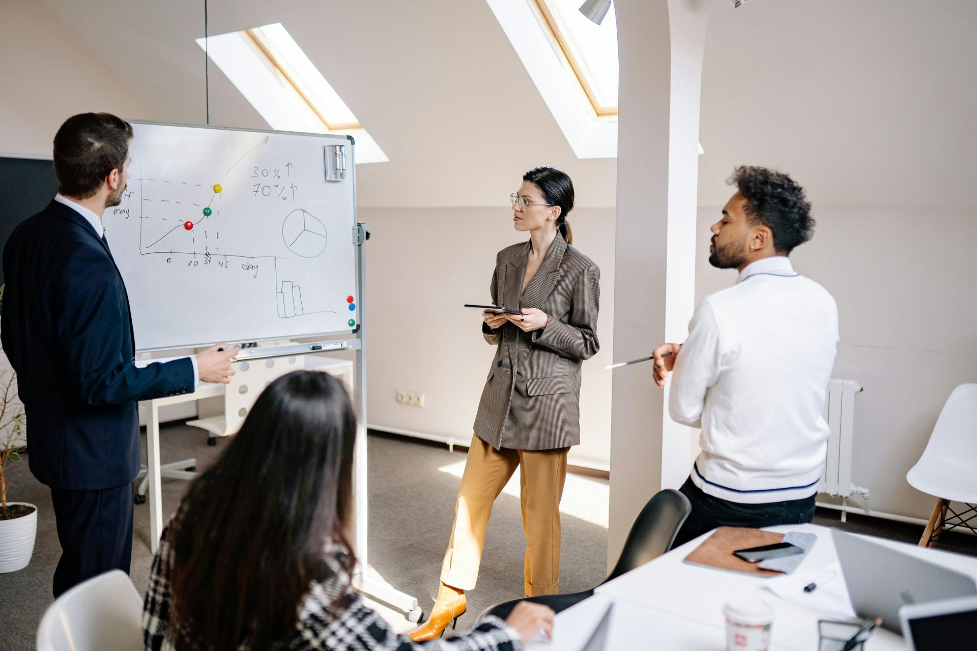 A group of people are having a meeting in an office.