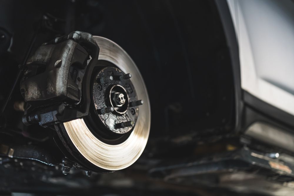 Car brake system, rotor and caliper, detail view.