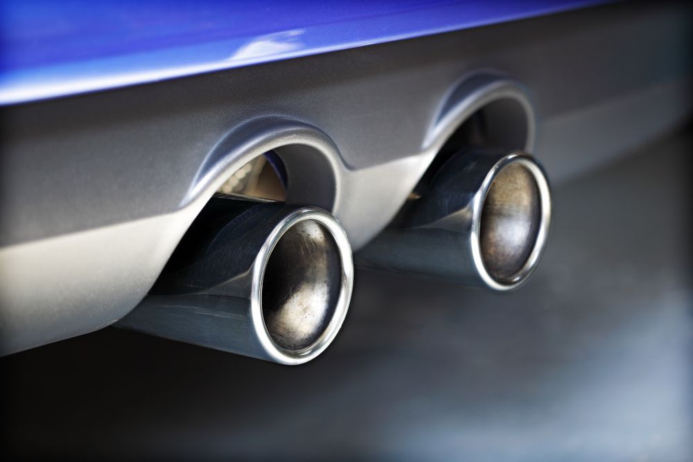 Chrome Exhaust Pipes on the Rear of a Blue Car — Ottos Mufflers in Noosaville, QLD