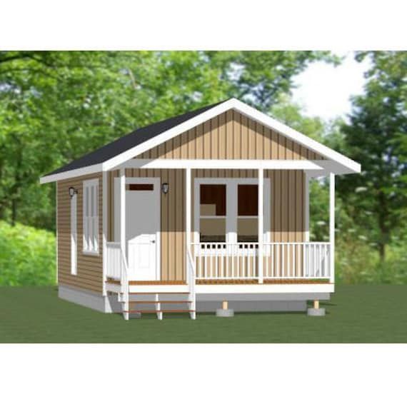 Small tan cabin with porch, white trim, and black roof, set against a green background.