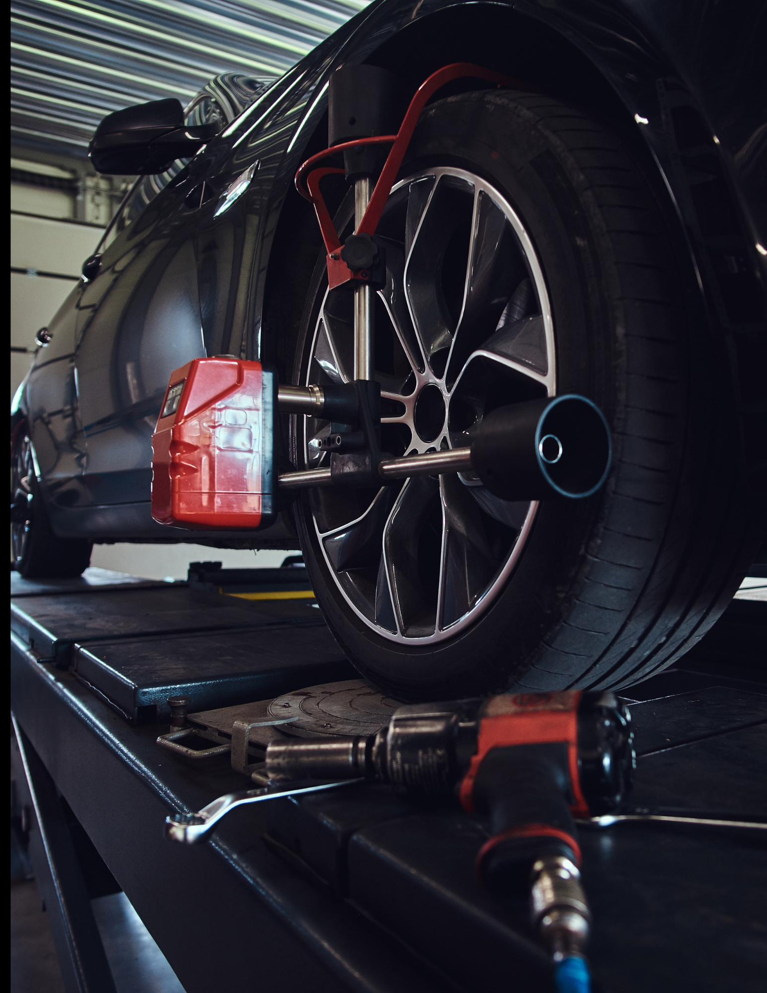Wheel alignment machine in a garage.