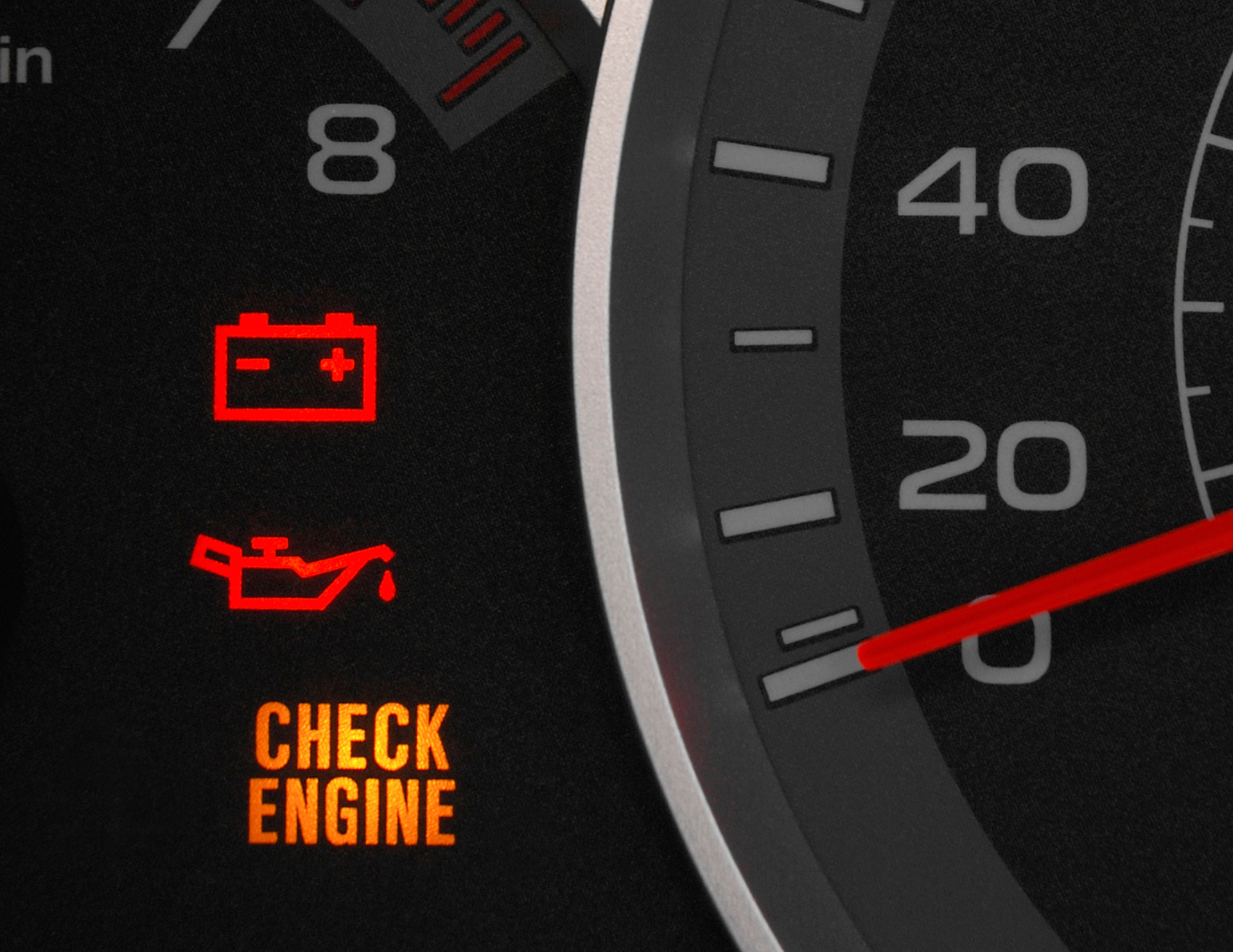 Car dashboard with warning lights: battery, oil, and 