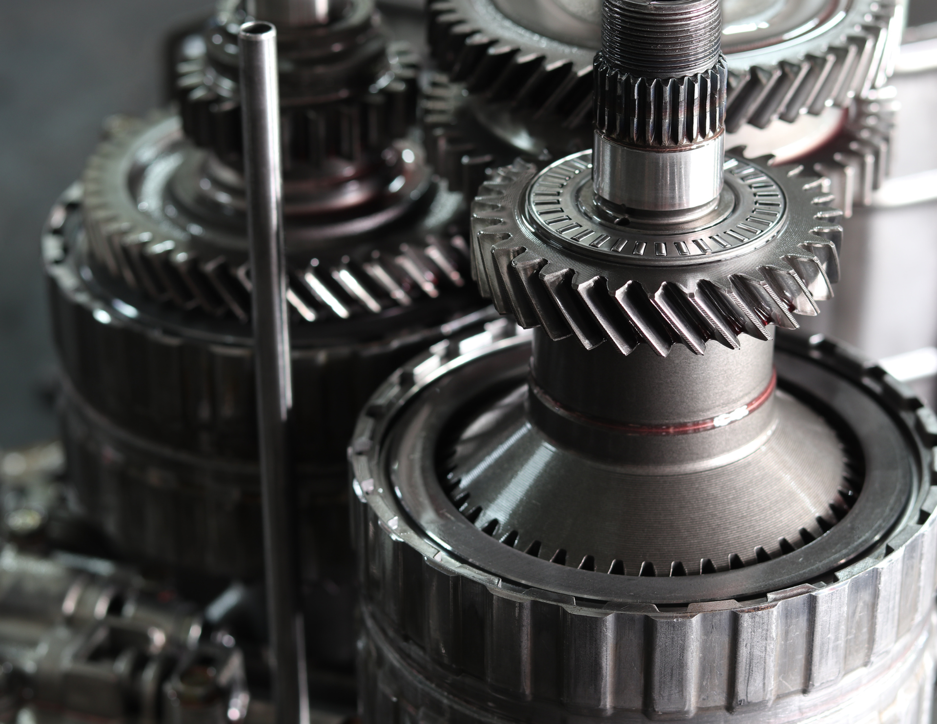 Close-up of interlocking metal gears, showcasing intricate mechanical details.