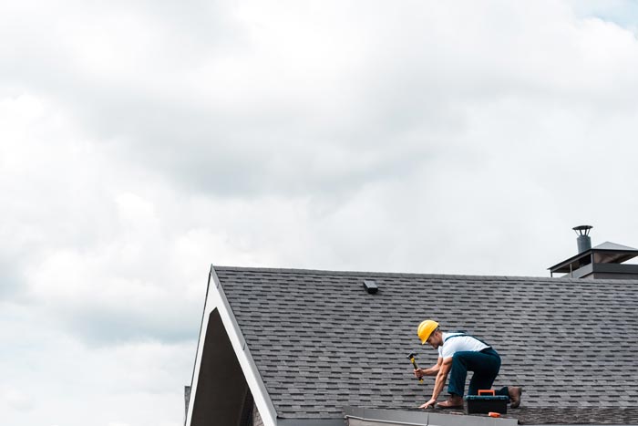Man Repairing Residential Roof — Madison, WI — Craftsman Exteriors