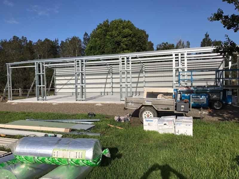 A Large Metal Structure Is Being Built In A Grassy Field – South Kempsey NSW - Fair Dinkum Builds Macleay Valley Sheds