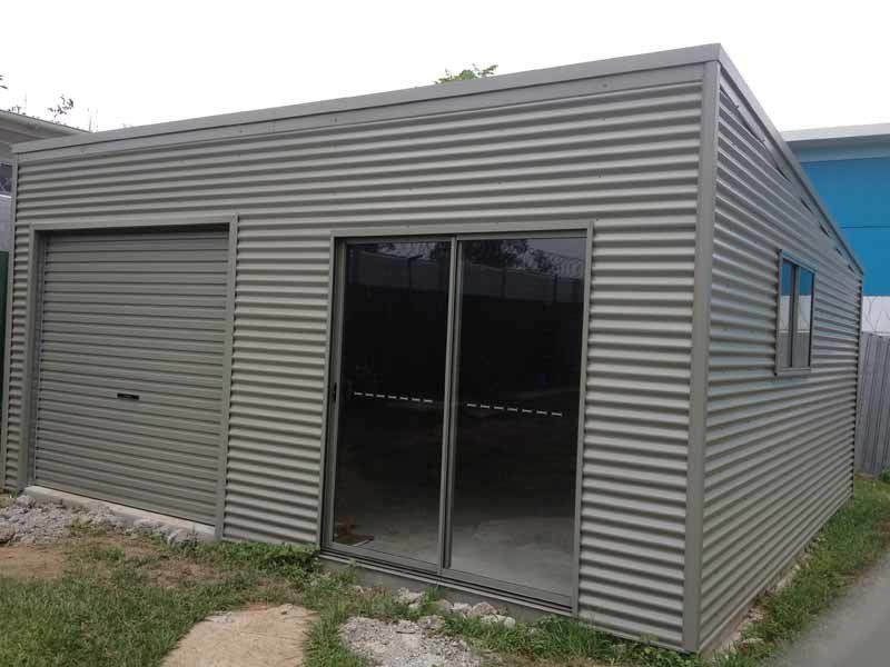 A Garage With A Sliding Glass Door And A Window – South Kempsey NSW - Fair Dinkum Builds Macleay Valley Sheds