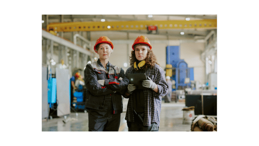 Mother and Daughter standing together in a factory