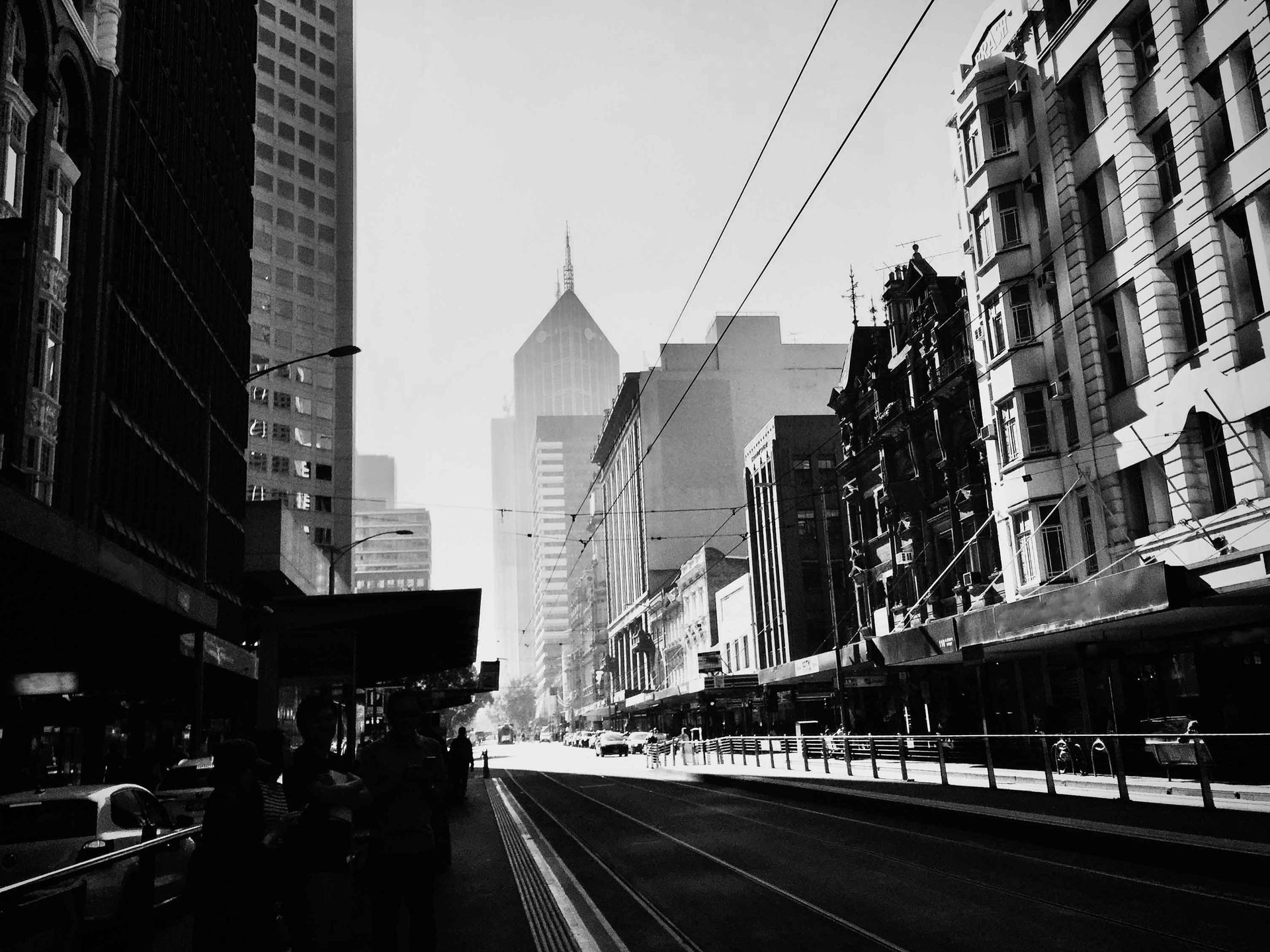 A black and white photo of a city street