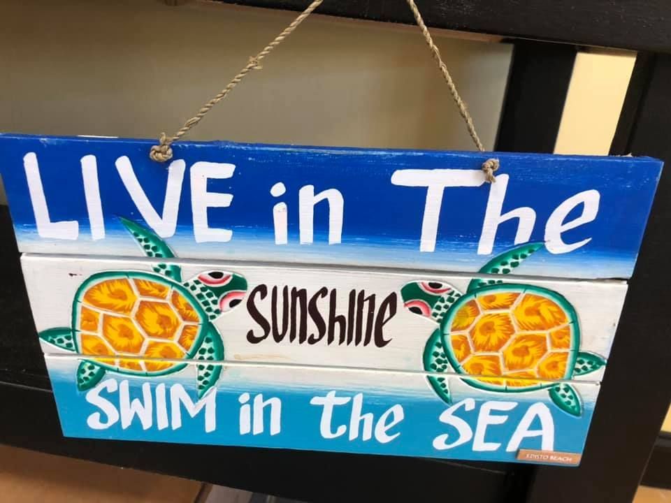 Blue wooden sign with 