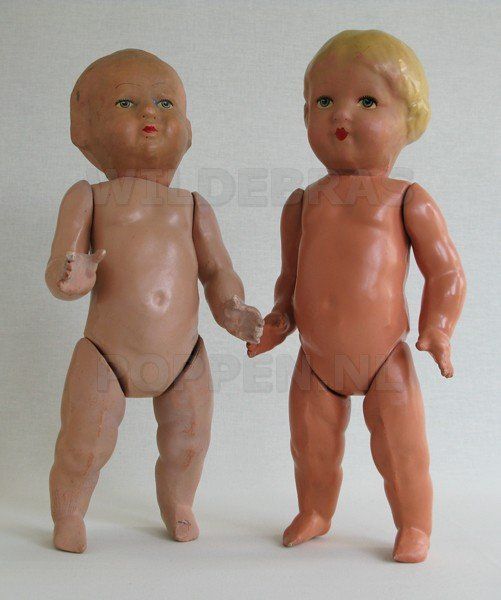 2 papier maché poppen