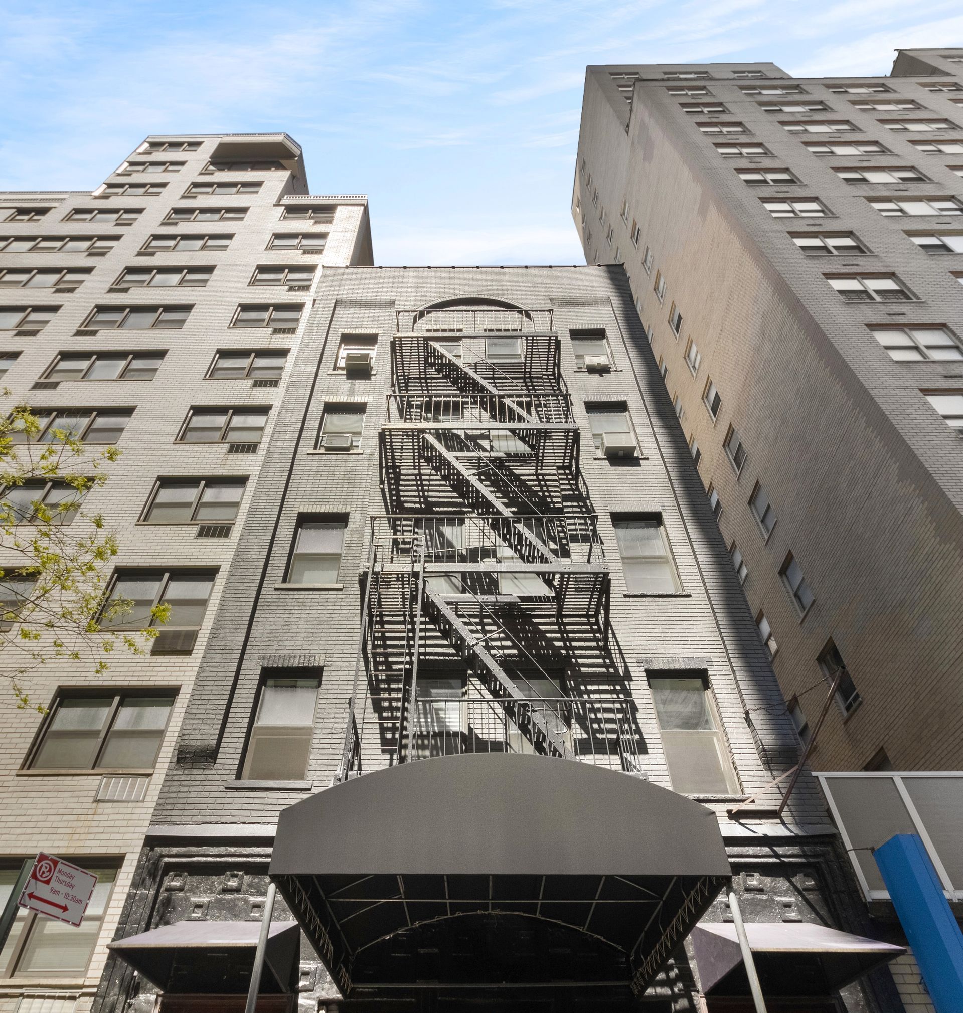 a fire escape on the side of a building that is owned by prex realty