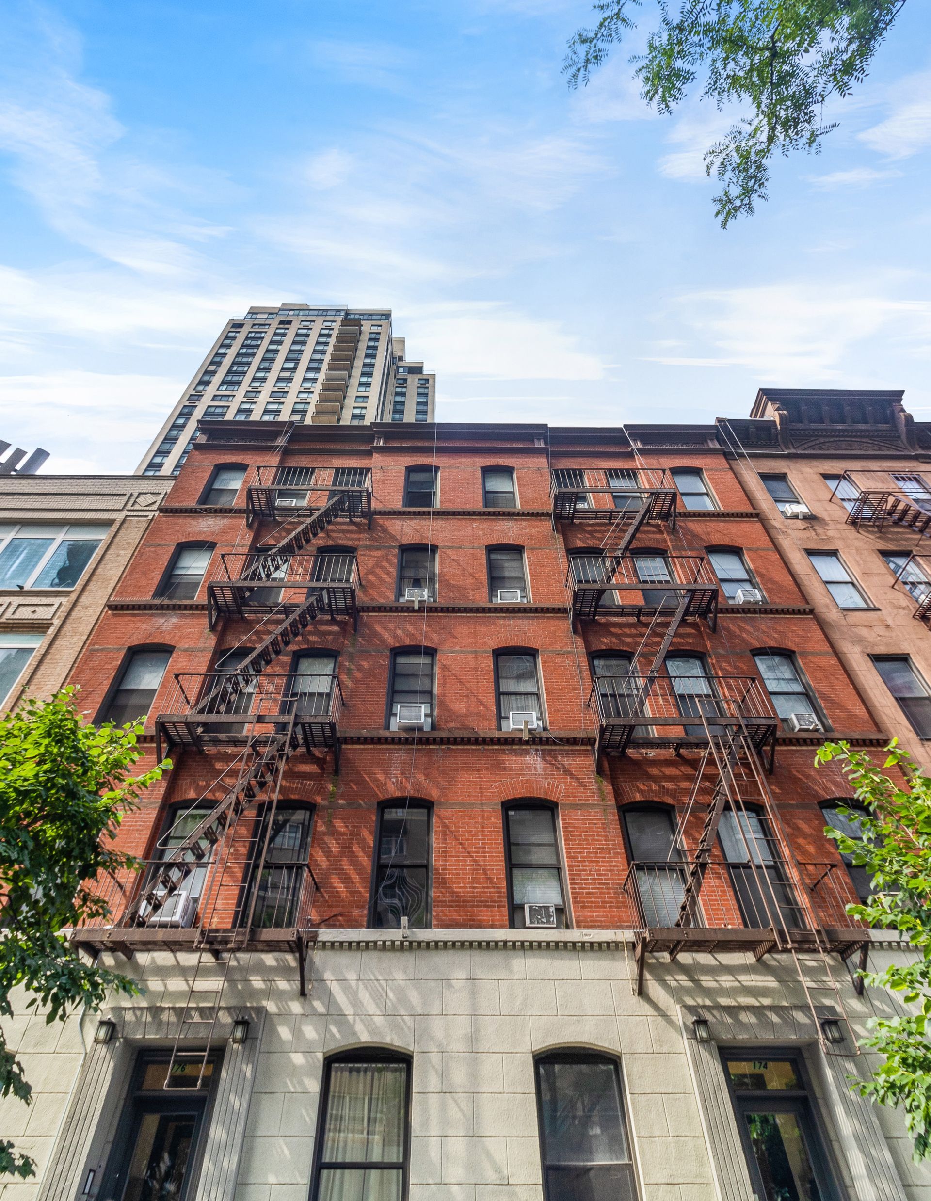 a brick building with a fire escape on the side