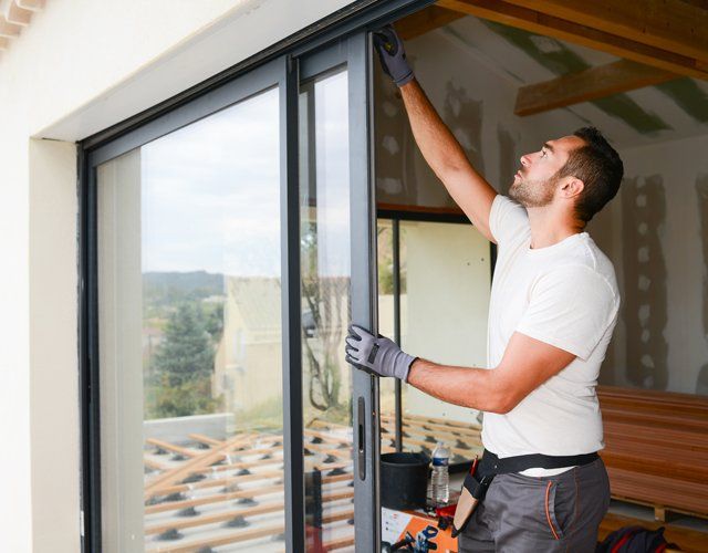 Windows — Man Installing A Window in Fayetteville, NC