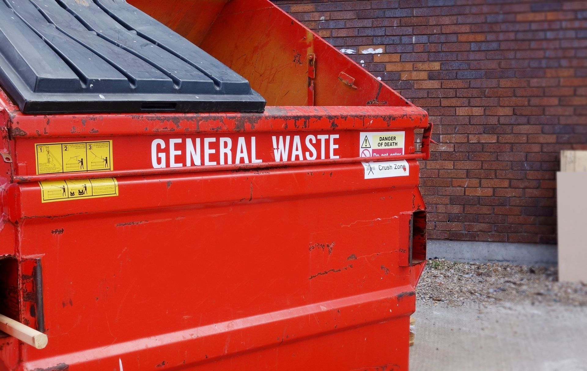 Red dumpster labeled 