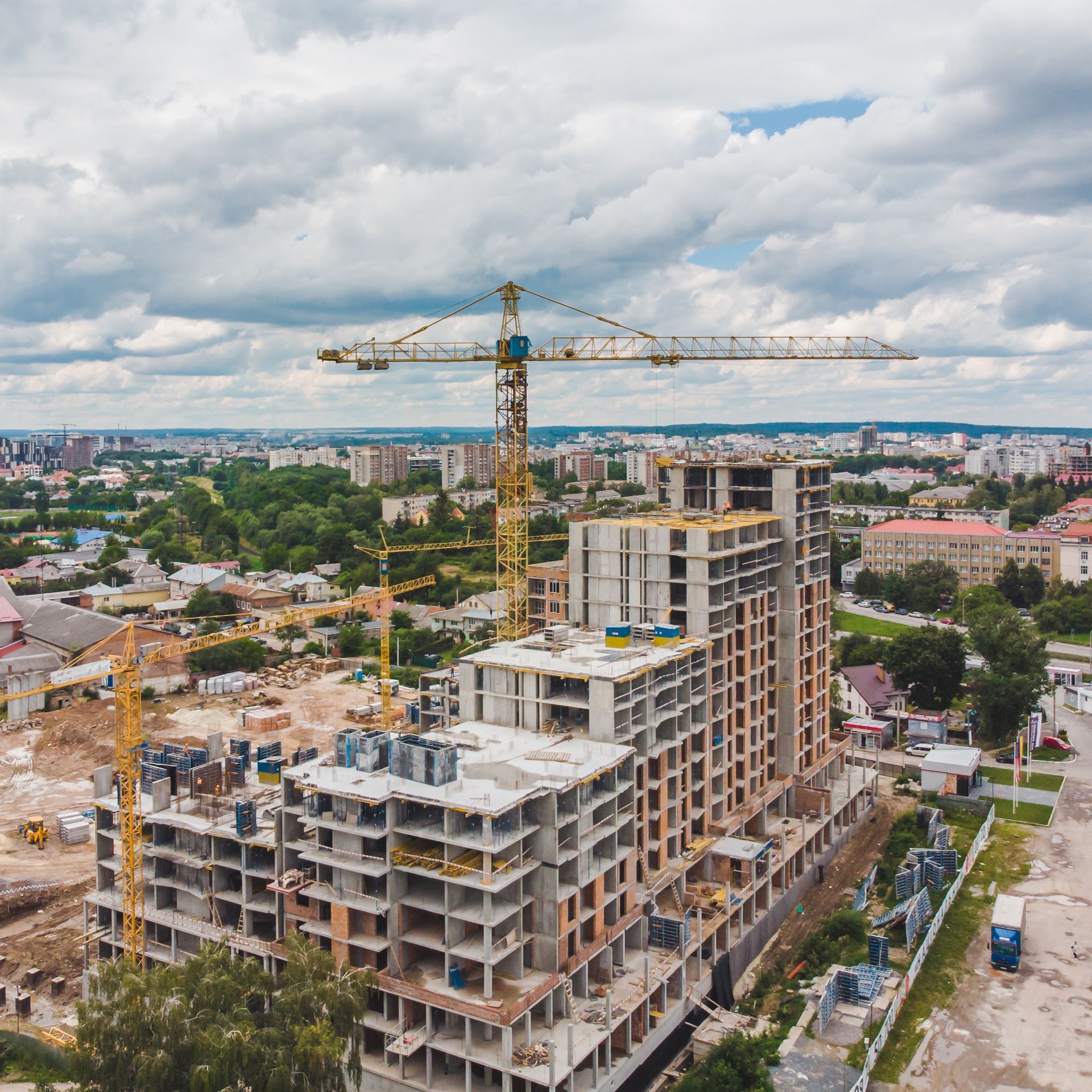 An aerial view of a building under construction in a city
